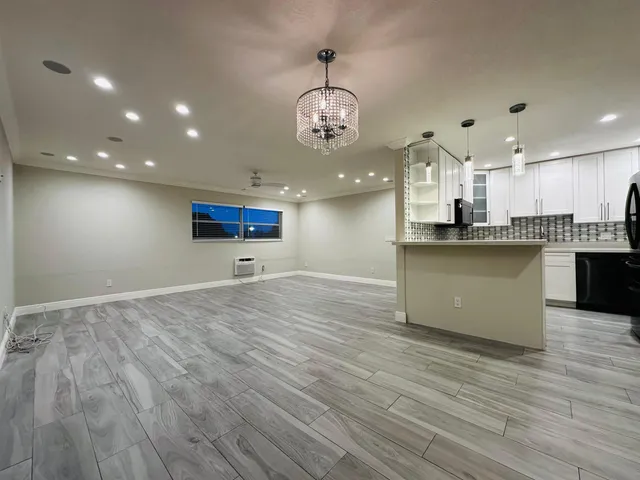 a view of a kitchen with cabinets