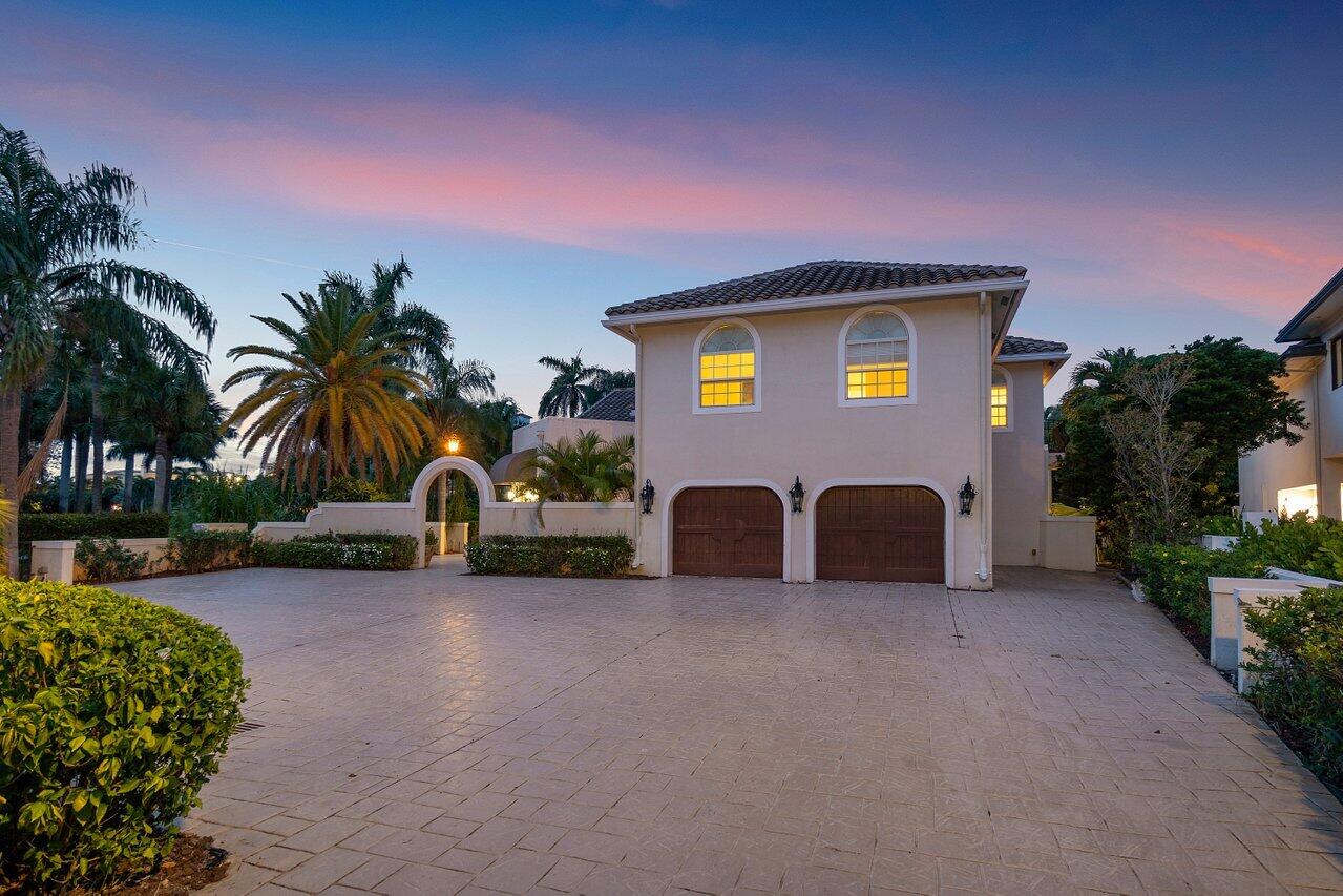 217 Thatch Palm Drive Boca Raton, FL 33432 - Photo 7 of 51 Twilight Front