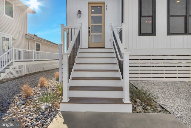 a view of a room with chandelier large windows and chandelier