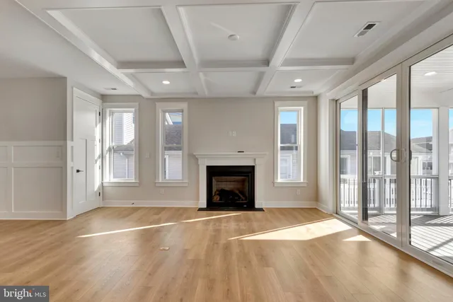 a view of a roof deck with wooden floor and fence