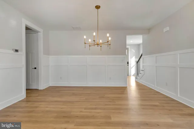 a kitchen with stainless steel appliances a stove a sink and a microwave