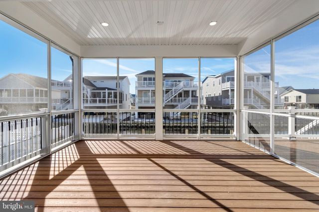 a kitchen with a sink a stove and cabinets