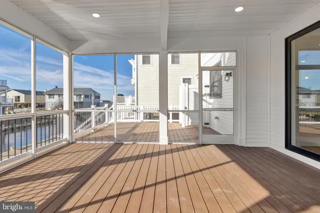 a kitchen with granite countertop a sink stove and cabinets