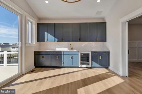 a view of a kitchen with a refrigerator