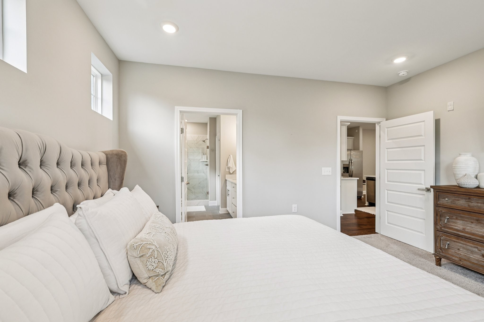 1801 Shadow Green Drive, Unit 306 Franklin, TN 37064 - Photo 15 of 39 a bedroom with a large bed and dresser