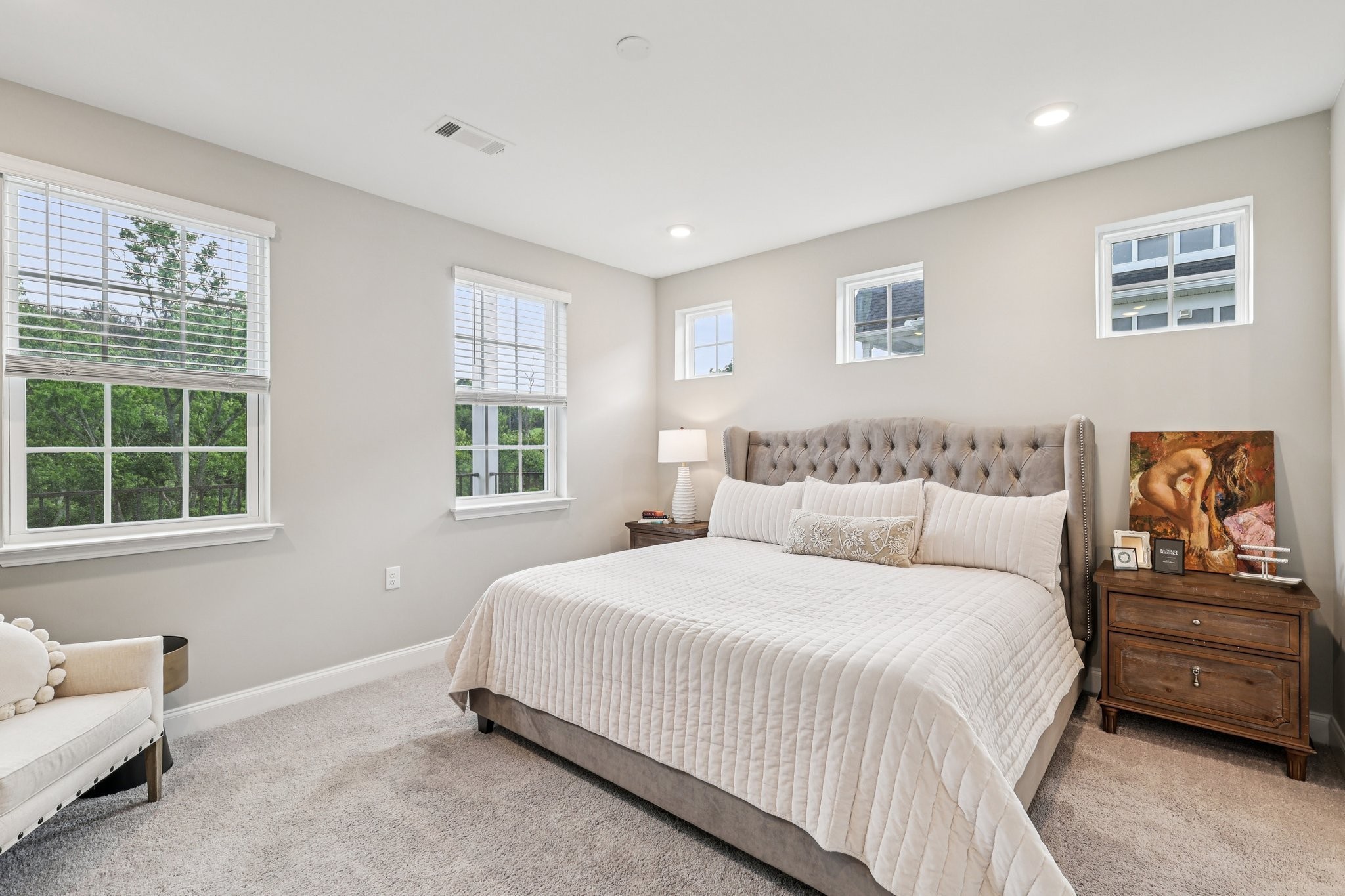 1801 Shadow Green Drive, Unit 306 Franklin, TN 37064 - Photo 16 of 39 a bedroom with a bed and wooden floor