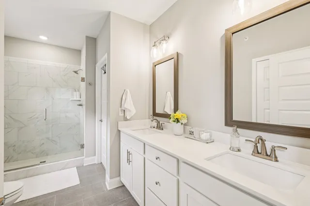 a bathroom with a sink vanity and a mirror
