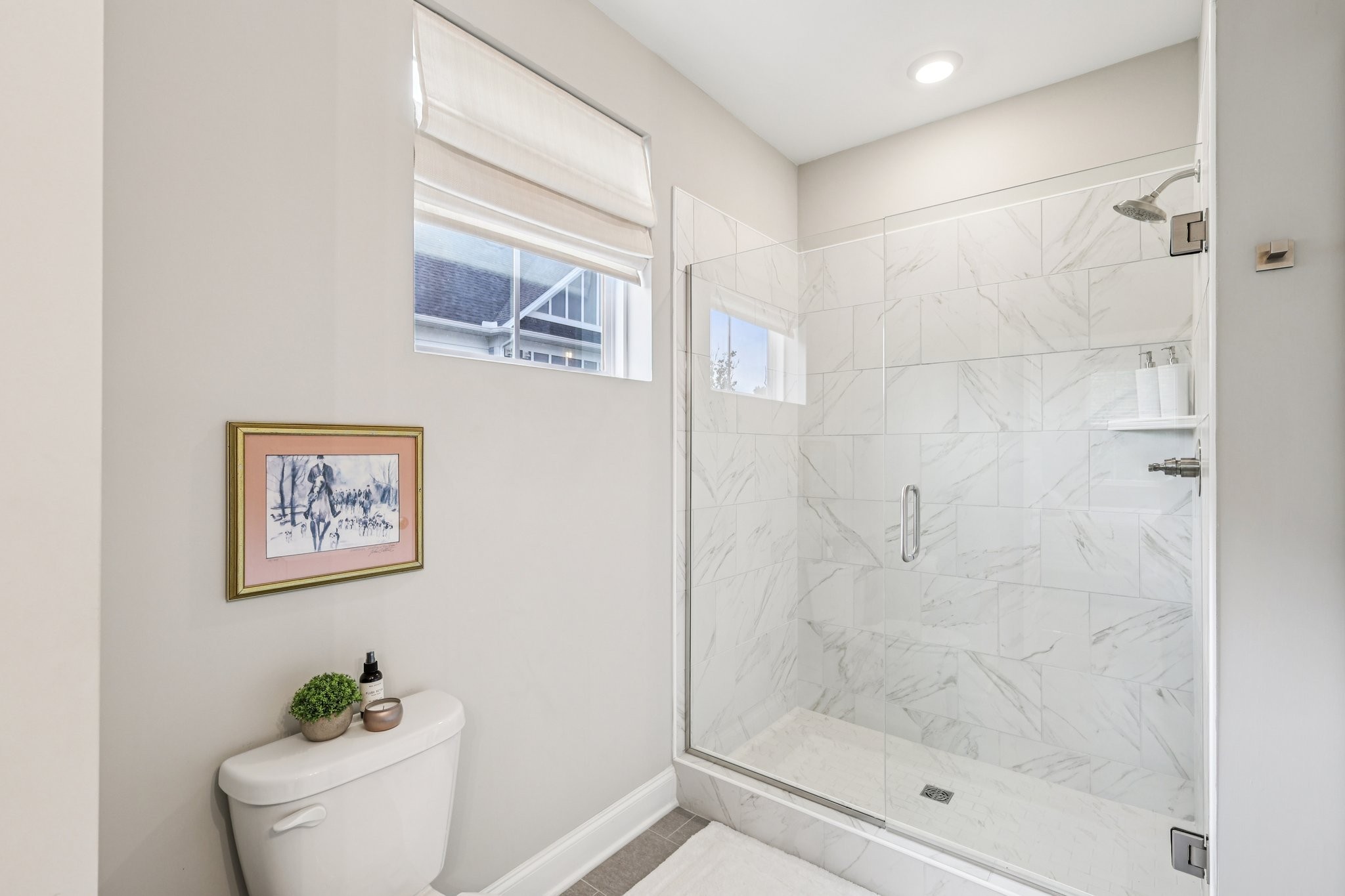 1801 Shadow Green Drive, Unit 306 Franklin, TN 37064 - Photo 20 of 39 a bathroom with a shower a toilet and a window