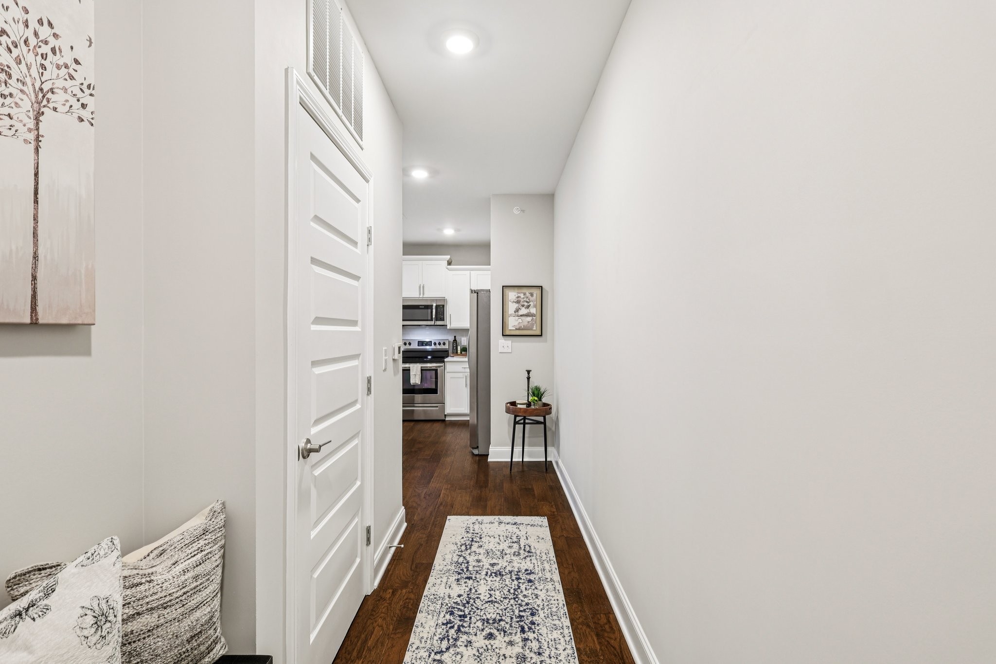 1801 Shadow Green Drive, Unit 306 Franklin, TN 37064 - Photo 2 of 39 a walk in closet with wooden floor