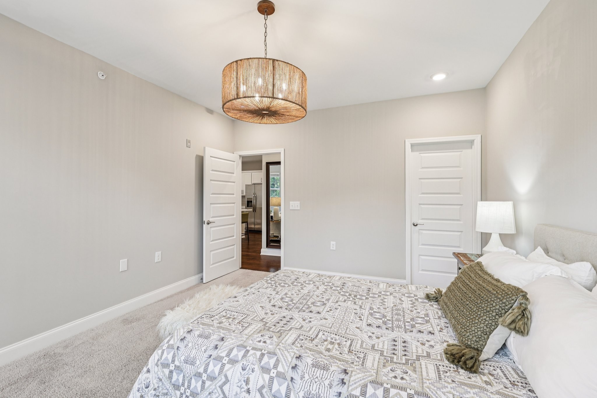 1801 Shadow Green Drive, Unit 306 Franklin, TN 37064 - Photo 27 of 39 a bedroom with a bed and wooden floor