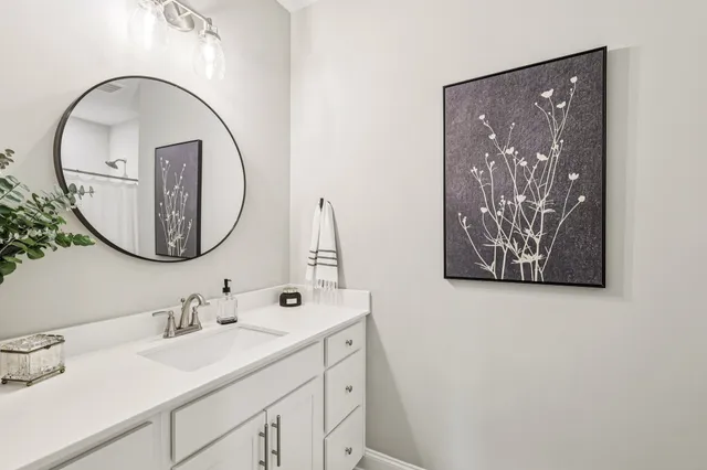 a white toilet sitting next to a shower curtain