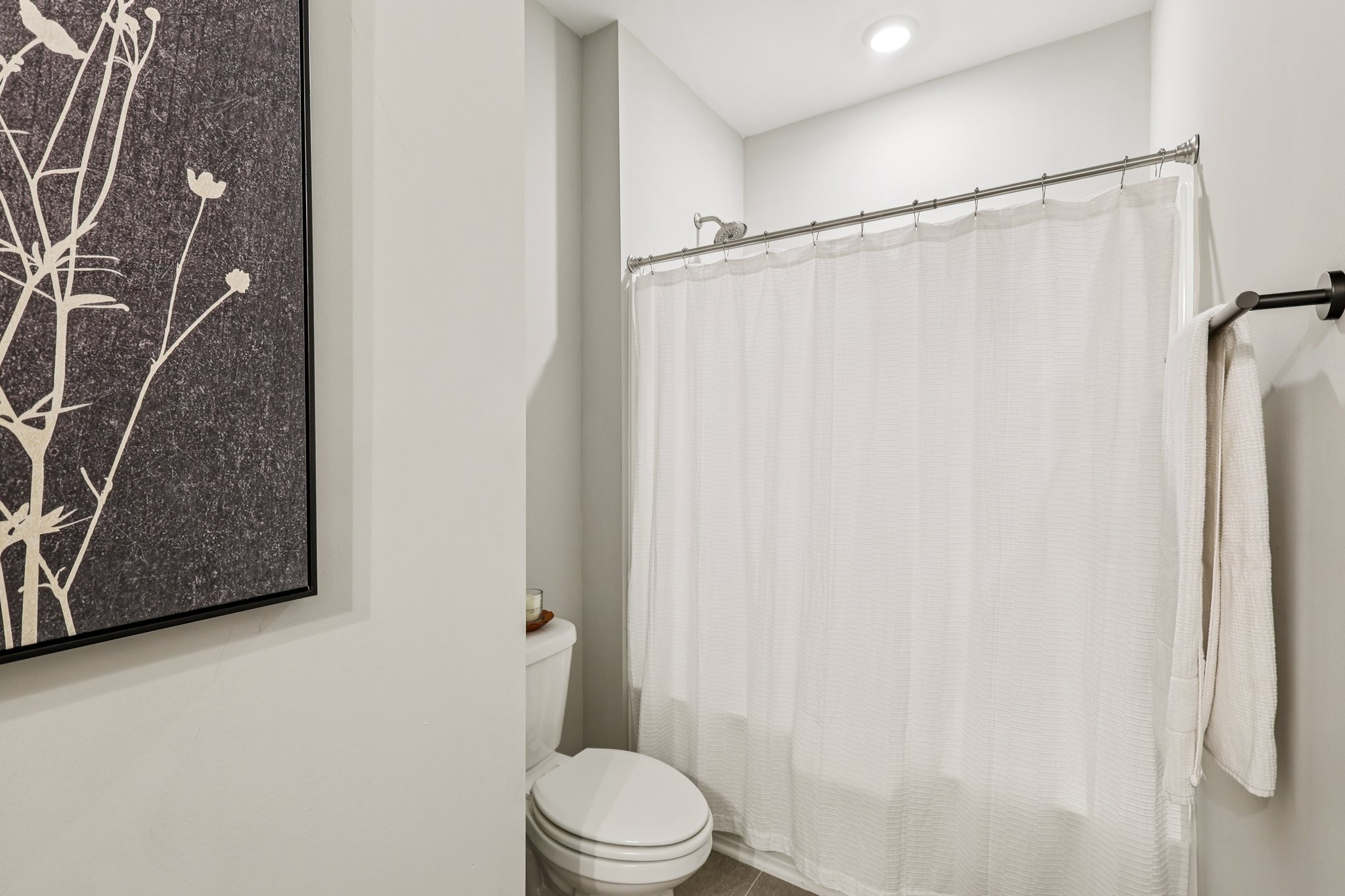 1801 Shadow Green Drive, Unit 306 Franklin, TN 37064 - Photo 29 of 39 a white toilet sitting next to a shower curtain