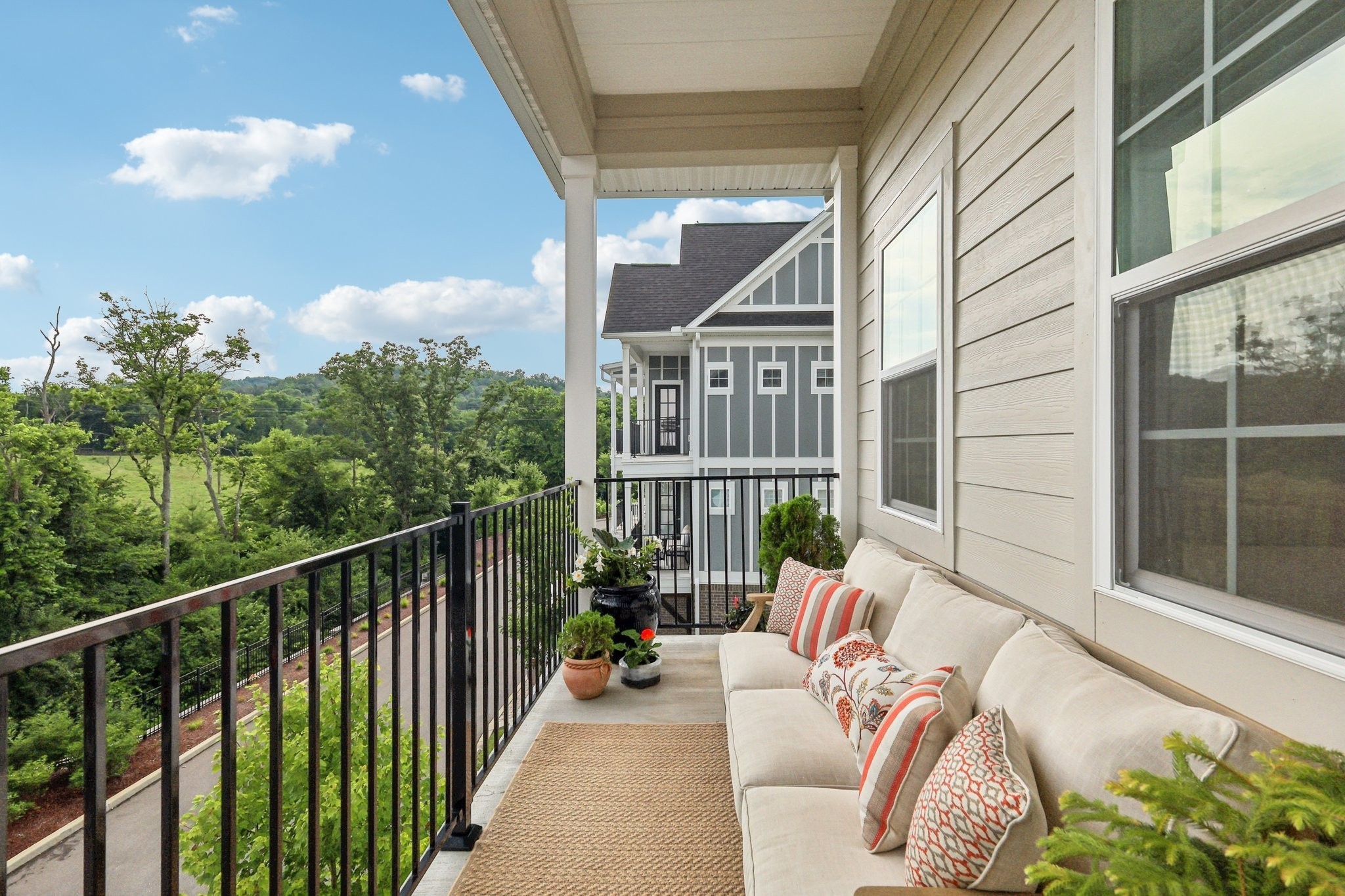1801 Shadow Green Drive, Unit 306 Franklin, TN 37064 - Photo 31 of 39 a balcony with furniture and a potted plant