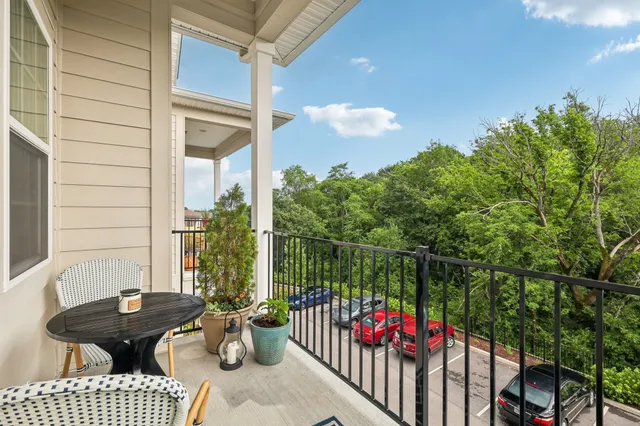 a view of a chair and table in the balcony