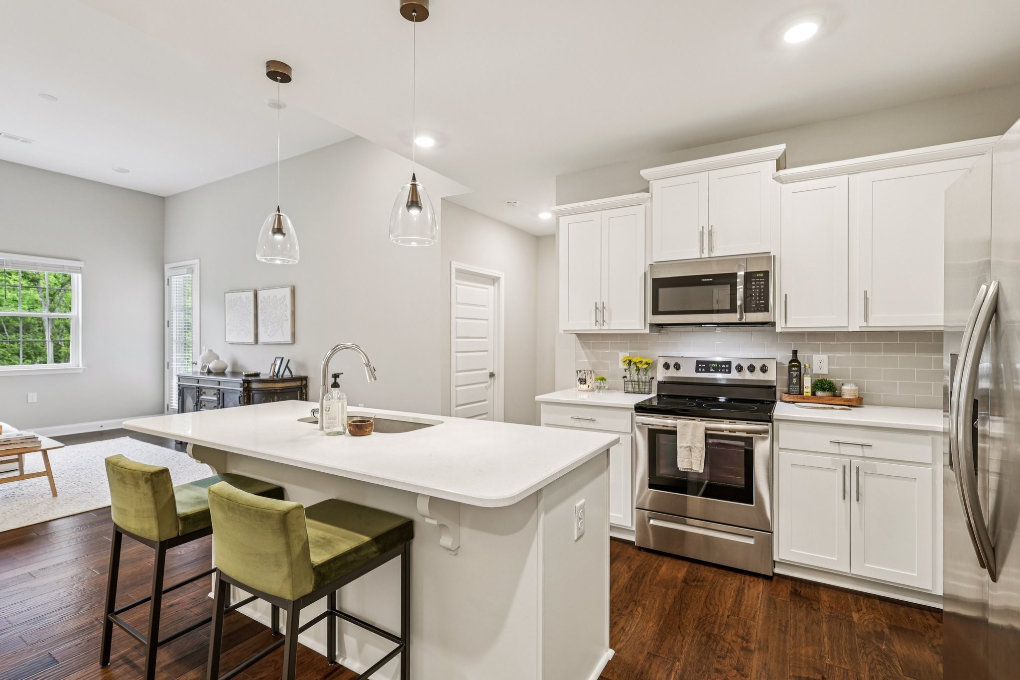 1801 Shadow Green Drive, Unit 306 Franklin, TN 37064 - Photo 5 of 39 a kitchen with a stove a sink and a refrigerator