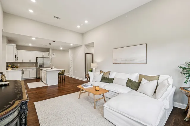 a living room with furniture and couches