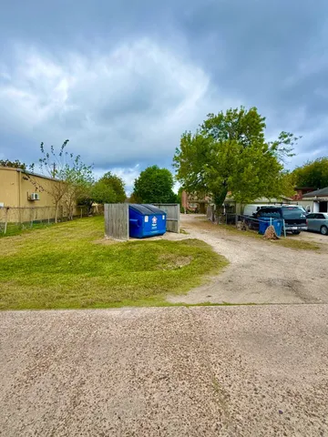 a view of a street with a building in the background