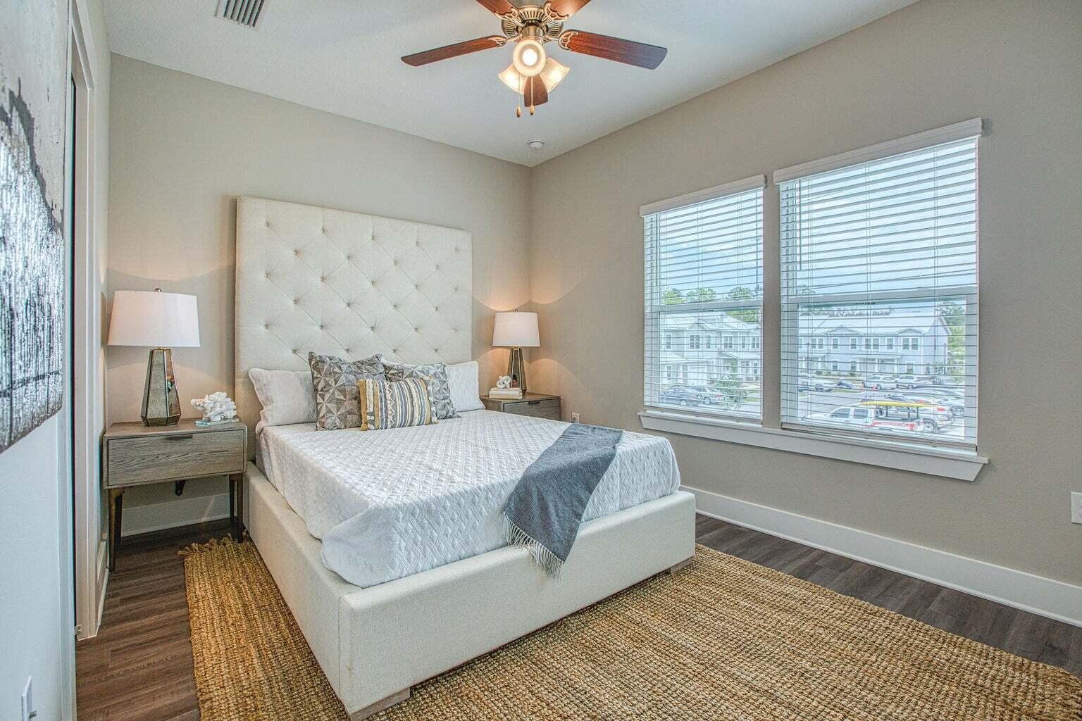 76 Date Palm Lane Freeport, FL 32439 - Photo 12 of 12 a bed room with a bed and a chandelier