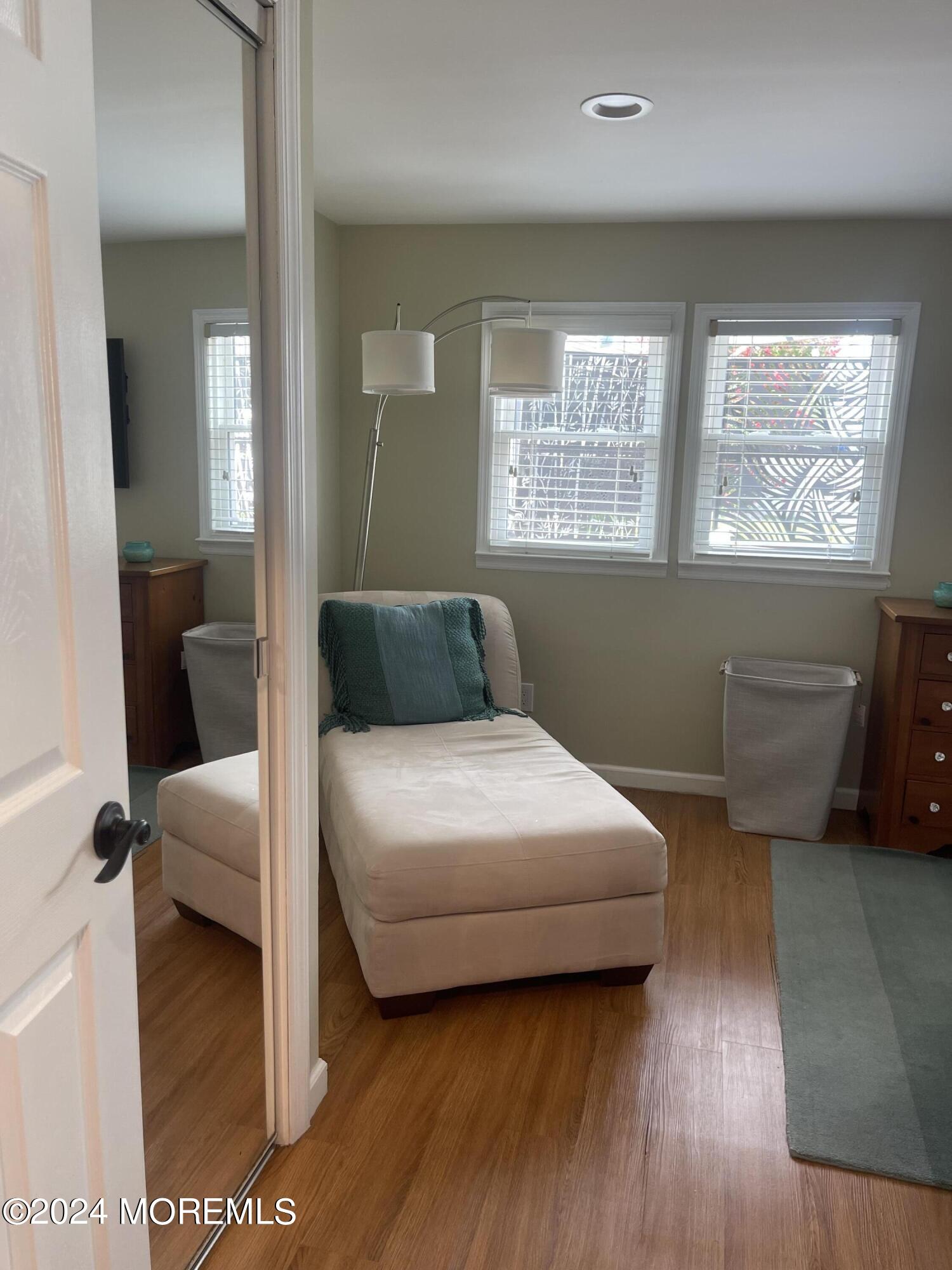 1407 River Road Belmar, NJ 07719 - Photo 17 of 26 a bedroom with a bed and a large window