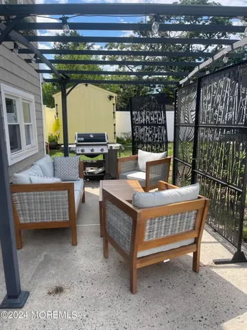 a view of a couches with wooden floor