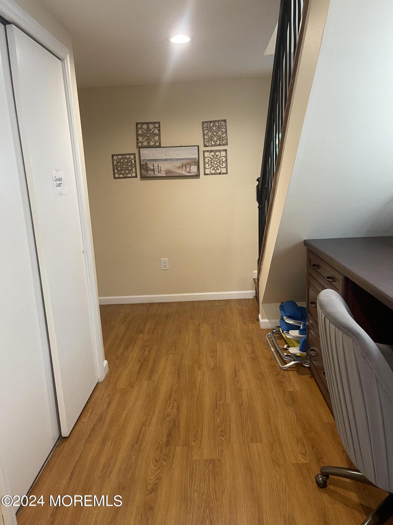1407 River Road Belmar, NJ 07719 - Photo 21 of 26 a view of a hallway with wooden floor