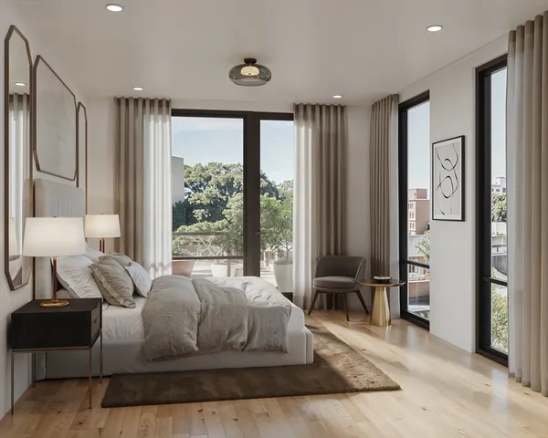 a spacious bedroom with a bed and glass windows