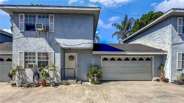 a front view of a house with parking