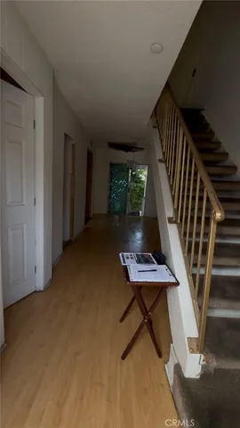 a view of a livingroom with furniture and wooden floor