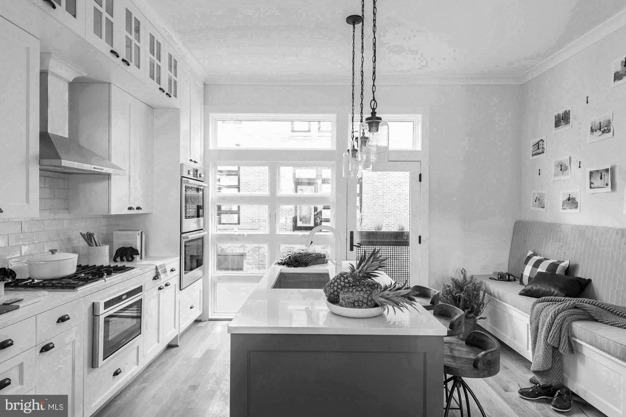 1307 D Street Southeast Washington, DC 20003 - Photo 4 of 27 Gourmet kitchen with island and bench