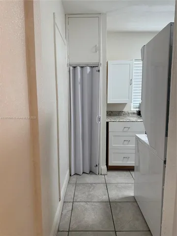 a kitchen with stainless steel appliances a refrigerator and cabinets