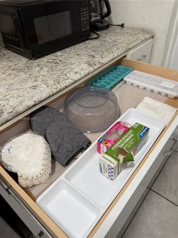 a stove top oven sitting inside of a kitchen