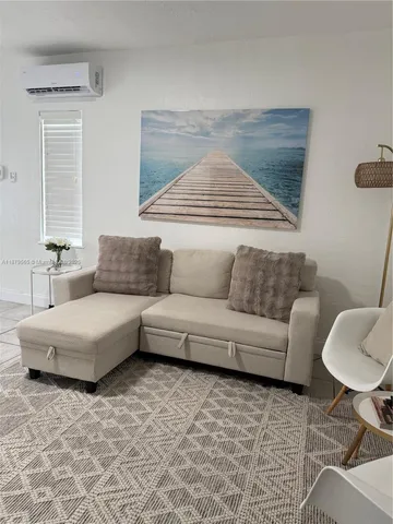 a living room with furniture and a couch