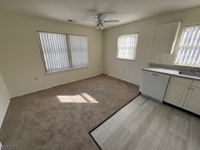 3203 Vail Road Parsippany, NJ 07054 - Photo 14 of 18 an empty room with windows and fan