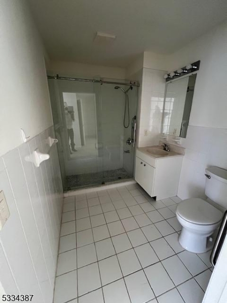 3203 Vail Road Parsippany, NJ 07054 - Photo 8 of 18 a bathroom with a sink toilet and shower