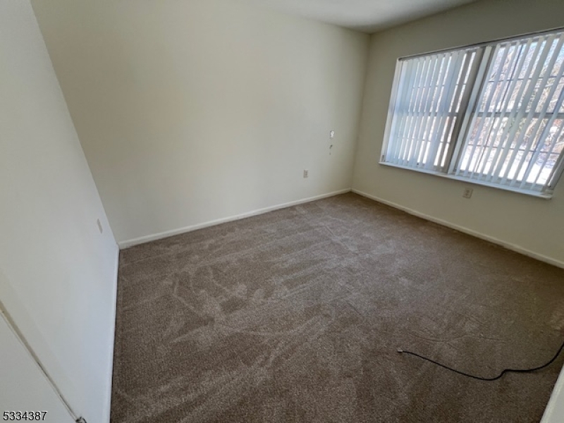 3203 Vail Road Parsippany, NJ 07054 - Photo 9 of 18 an empty room with windows