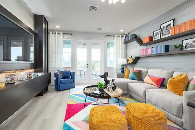 a living room with furniture rug and window