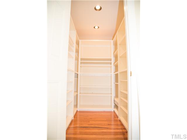 4809 Poland Place Raleigh, NC 27609 - Photo 11 of 25 a view of a hallway with wooden floor