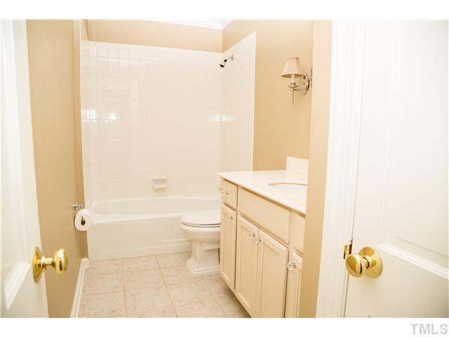 4809 Poland Place Raleigh, NC 27609 - Photo 12 of 25 a bathroom with a sink a toilet and shower