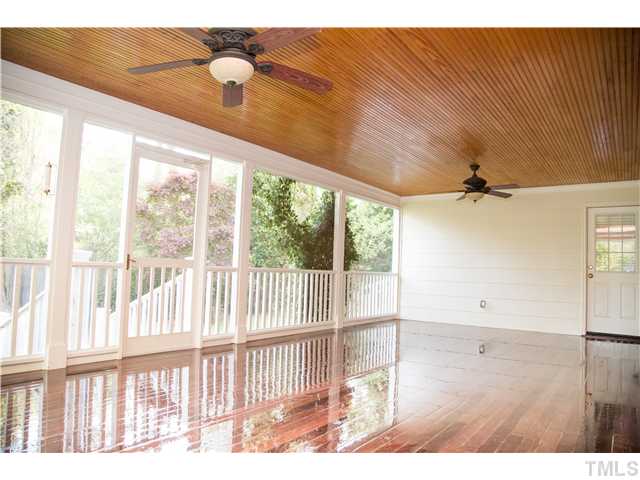 4809 Poland Place Raleigh, NC 27609 - Photo 25 of 25 a view of a livingroom with wooden floor and a ceiling fan