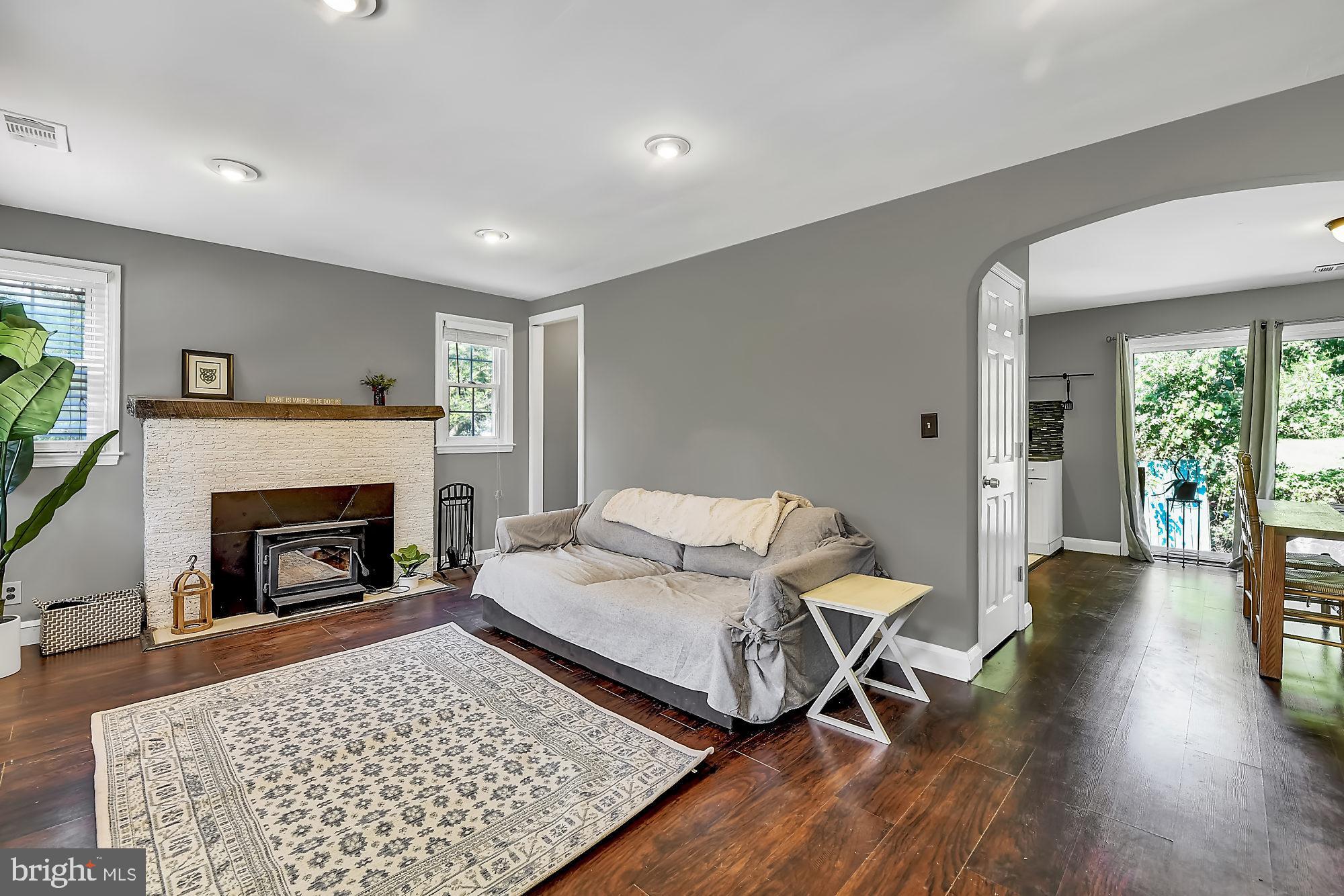 5903 Meadow Road Baltimore, MD 21206 - Photo 7 of 38 Spacious Living Room With Wood Stove