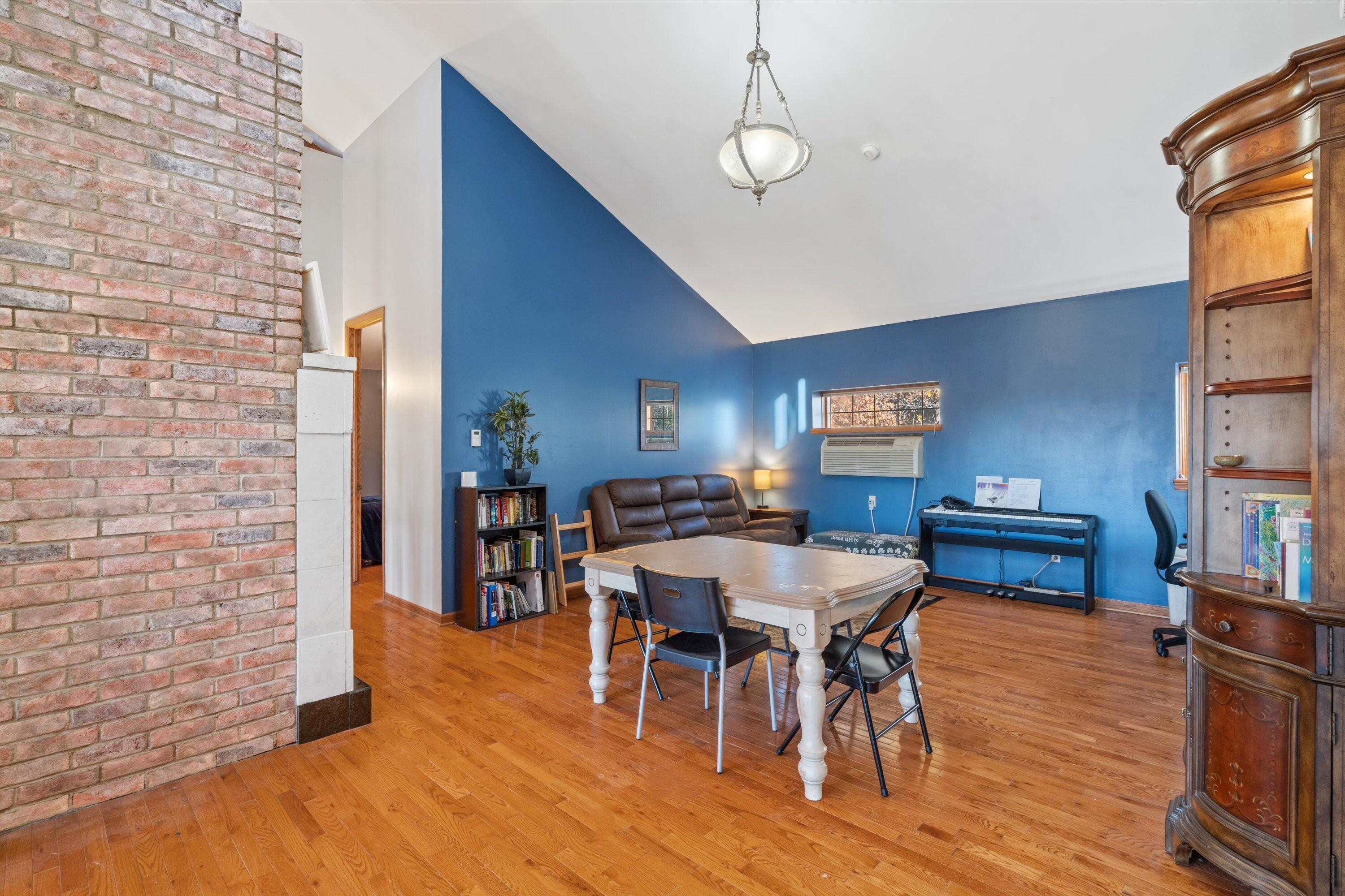 N44W25902 Lindsay Road Pewaukee, WI 53072 - Photo 29 of 92 Upper Level Family Room Loft with Vaulted Ceilings and Fireplace