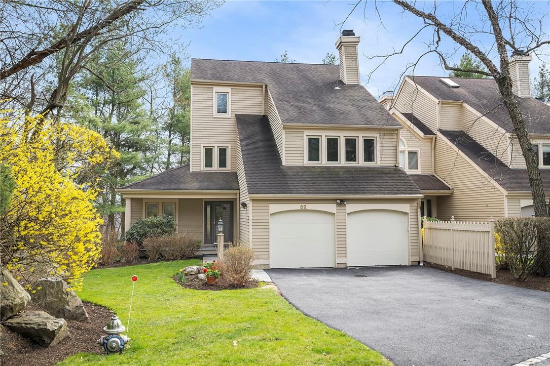 52 Ledge Crest Scarsdale, NY 10583 - Photo 1 of 1 a front view of a house with a yard and garage