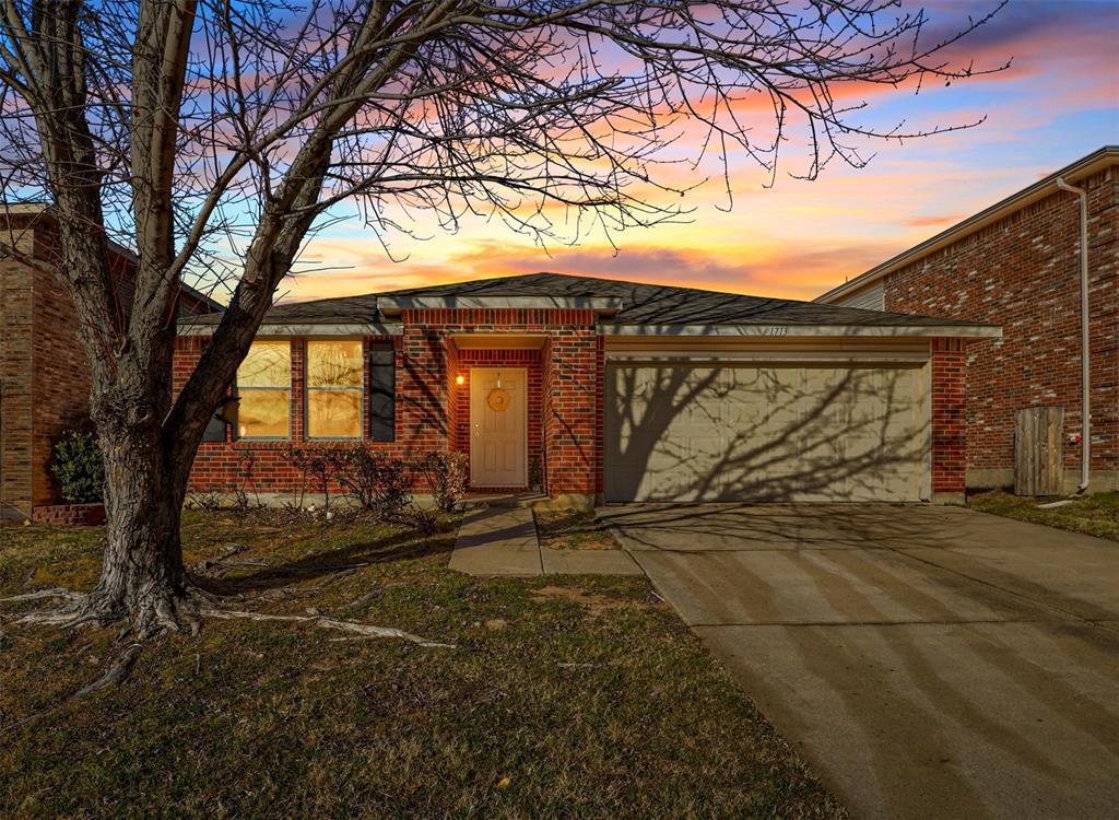 a view of a wooden house with a large tree