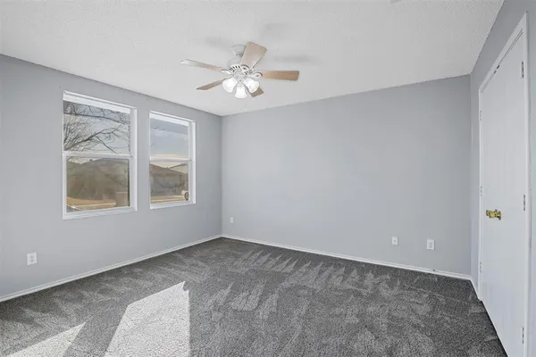 a view of an empty room with a window
