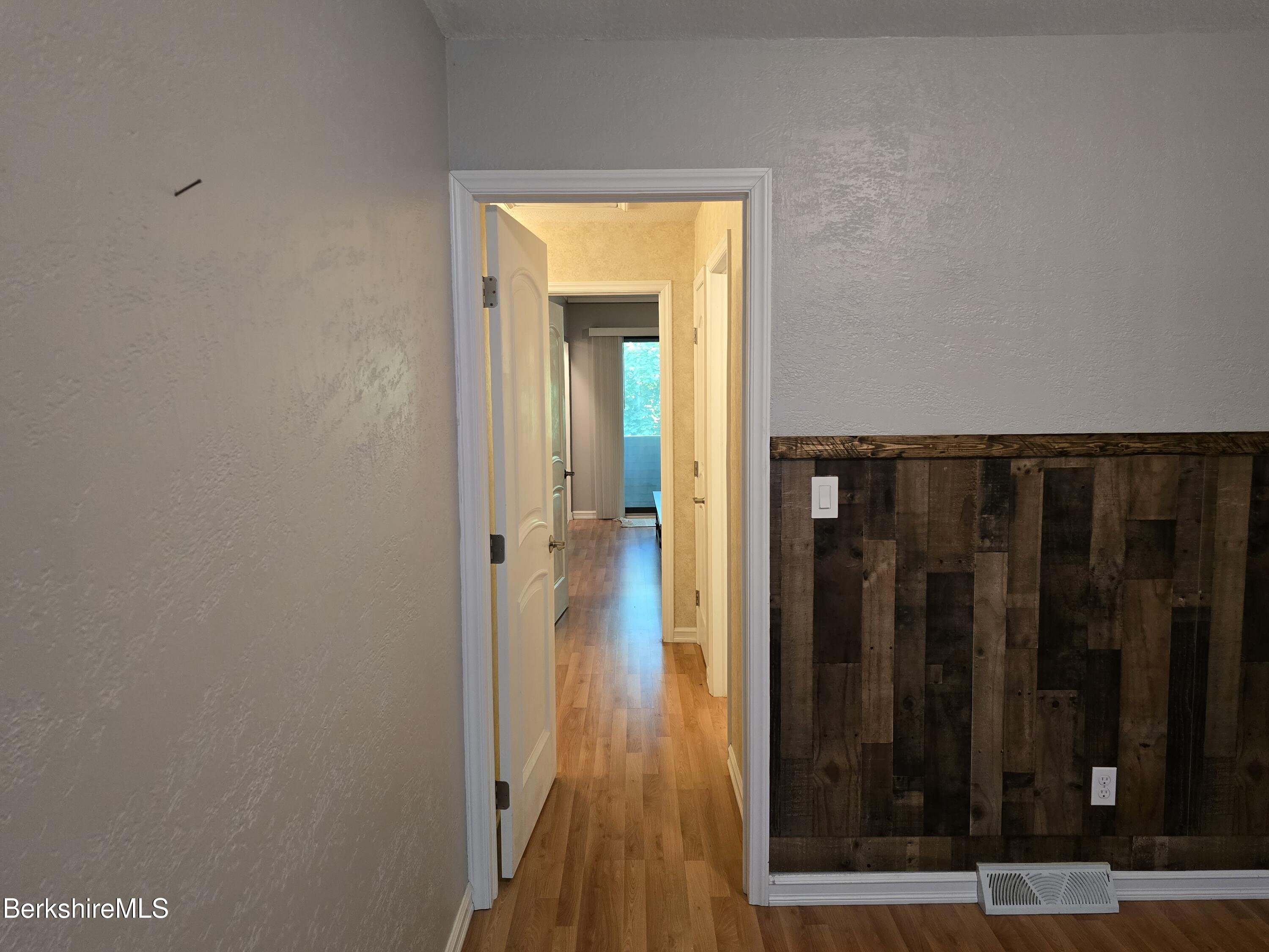 555 Russell Road, Unit J 65 Westfield, MA 01085 - Photo 16 of 20 a view of walk in closet with wooden floor