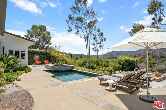 a view of a terrace with sitting area