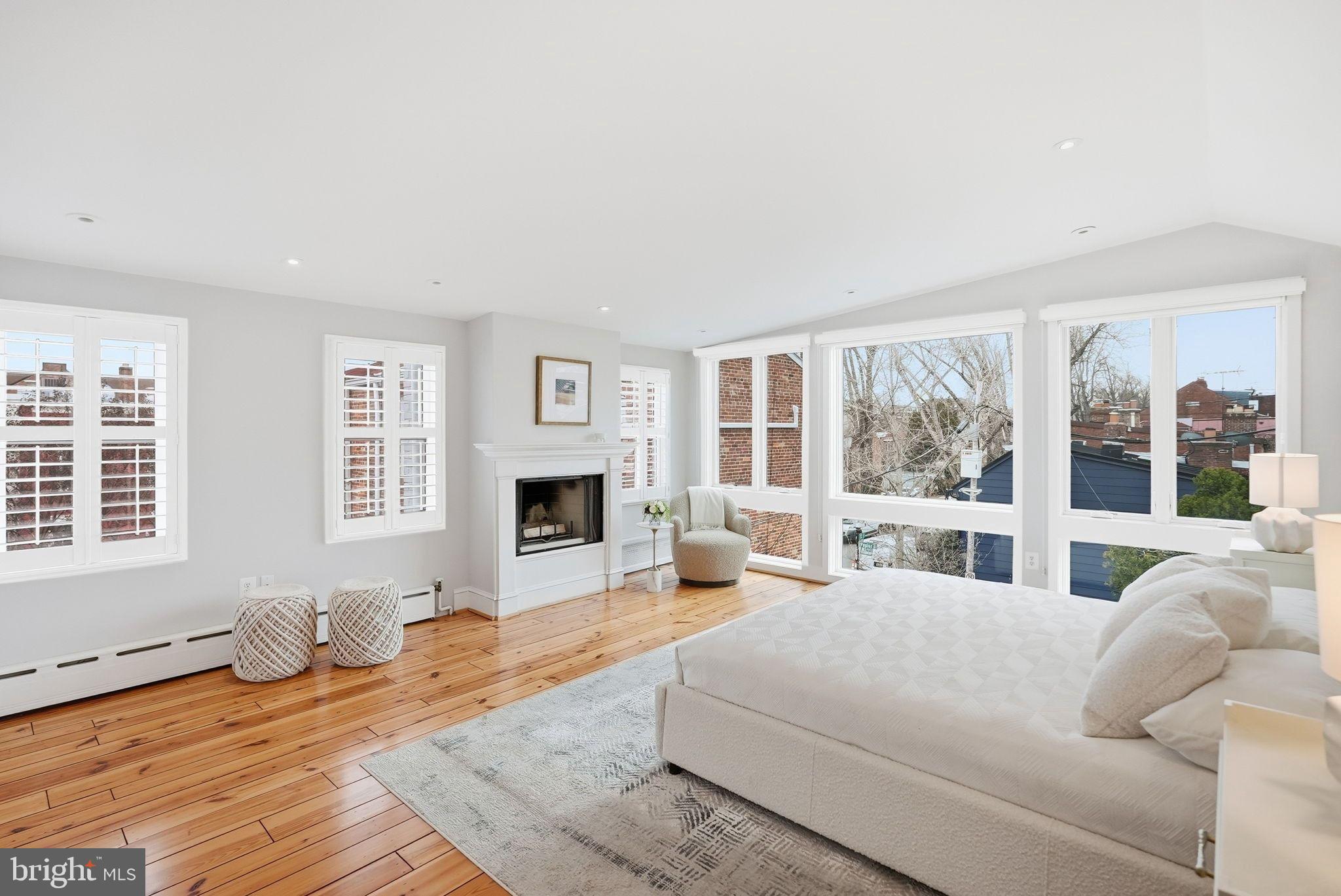 2708 P Street Northwest Washington, DC 20007 - Photo 13 of 35 a living room with fireplace furniture and a floor to ceiling window