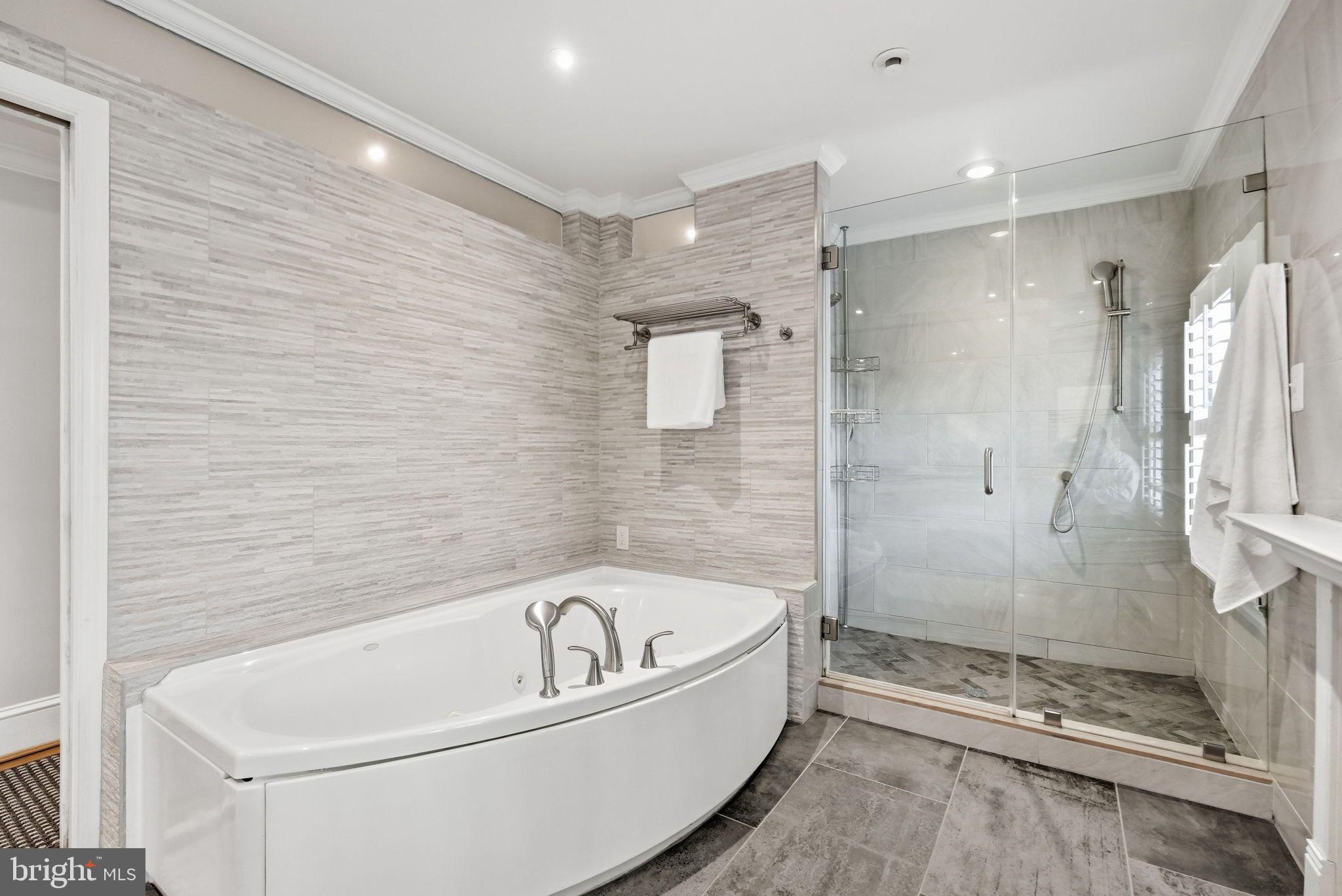 2708 P Street Northwest Washington, DC 20007 - Photo 17 of 35 a bathroom with a bathtub and a shower