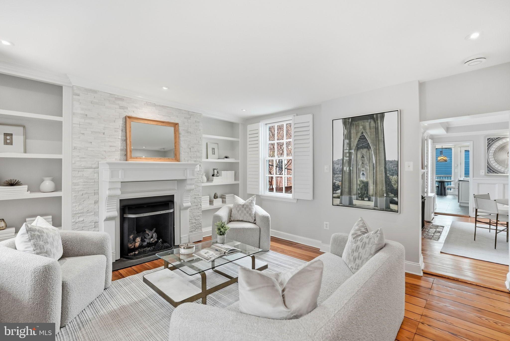 2708 P Street Northwest Washington, DC 20007 - Photo 4 of 35 a living room with furniture and a fireplace