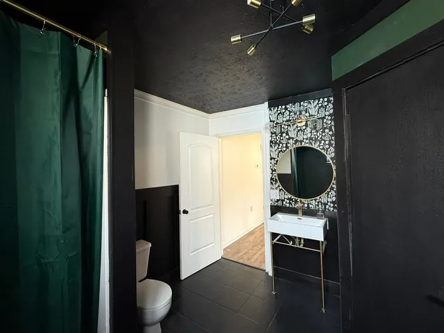 a bathroom with a sink and mirror